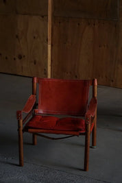 Set_of_2_Arne_Norell_Sirocco_Safari_Chairs_in_Rosewood_and_Red_Leather,_Sweden,_1960s