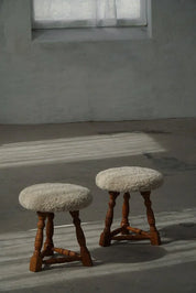 Set_of_2_Danish_Oak_Tripod_Stools_with_Shearling_Seats,_1950s