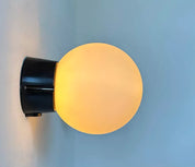 Set_of_2_Opaline_Glass_and_Bakelite_Wall_Sconces_by_RAAK,_Netherlands_1970s
