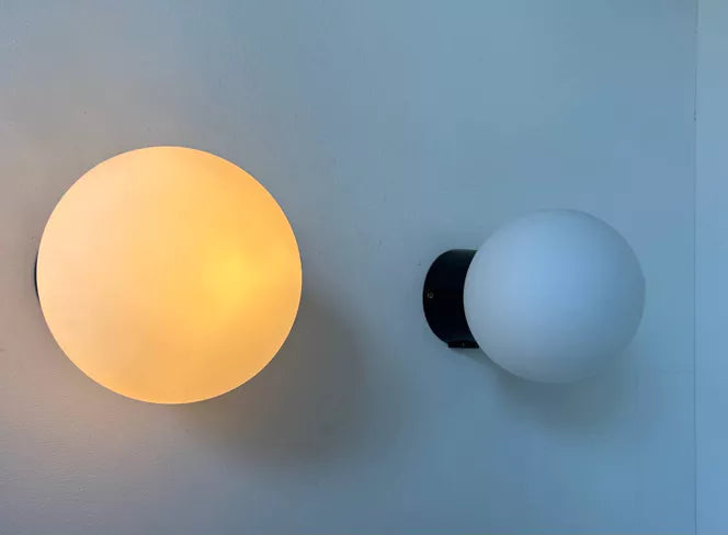 Set_of_2_Opaline_Glass_and_Bakelite_Wall_Sconces_by_RAAK,_Netherlands_1970s