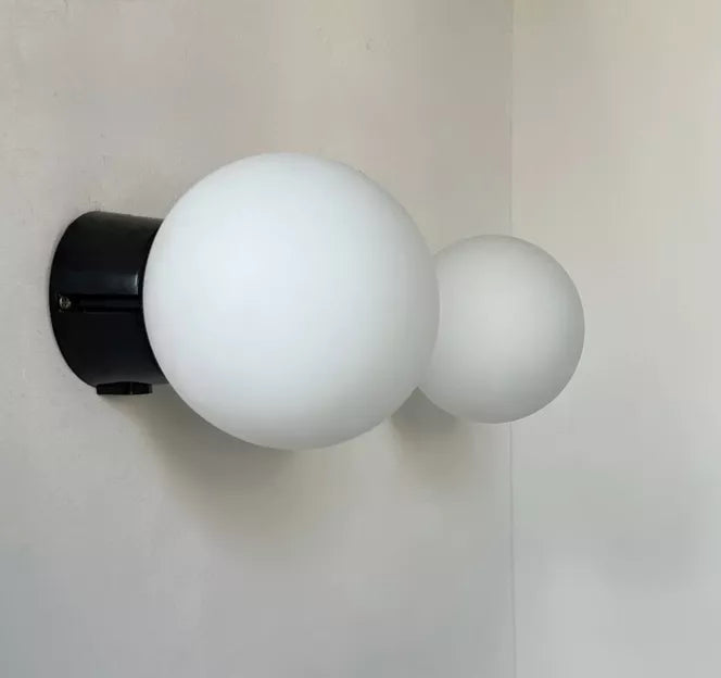 Set_of_2_Opaline_Glass_and_Bakelite_Wall_Sconces_by_RAAK,_Netherlands_1970s
