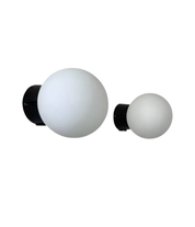 Set_of_2_Opaline_Glass_and_Bakelite_Wall_Sconces_by_RAAK,_Netherlands_1970s