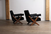 Set_of_2_Pierre_Jeanneret_PJ-SI-48-A_X-Leg_Lounge_Chairs_in_Teak_and_Black_Pony,_Chandigarh,_circa_1960