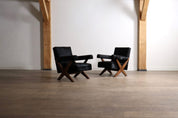 Set_of_2_Pierre_Jeanneret_PJ-SI-48-A_X-Leg_Lounge_Chairs_in_Teak_and_Black_Pony,_Chandigarh,_circa_1960