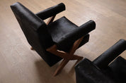 Set_of_2_Pierre_Jeanneret_PJ-SI-48-A_X-Leg_Lounge_Chairs_in_Teak_and_Black_Pony,_Chandigarh,_circa_1960