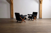 Set_of_2_Pierre_Jeanneret_PJ-SI-48-A_X-Leg_Lounge_Chairs_in_Teak_and_Black_Pony,_Chandigarh,_circa_1960