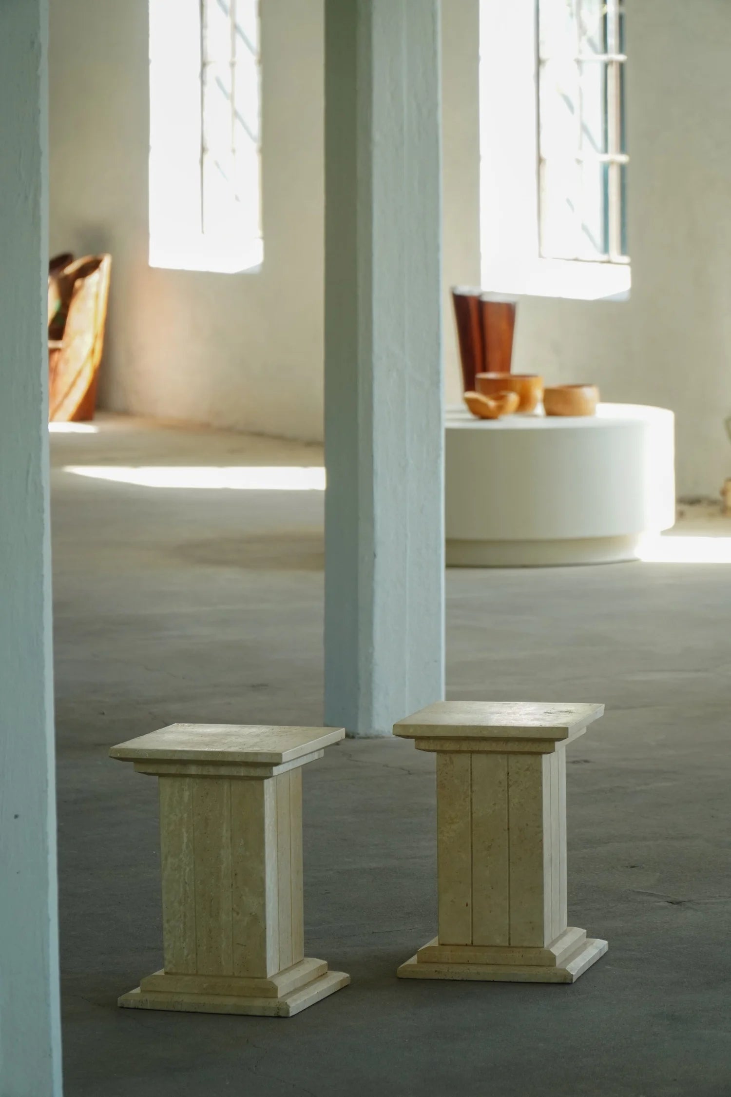 Set_of_2_Sculptural_Travertine_Display_Pedestals,_Italy,_1970s