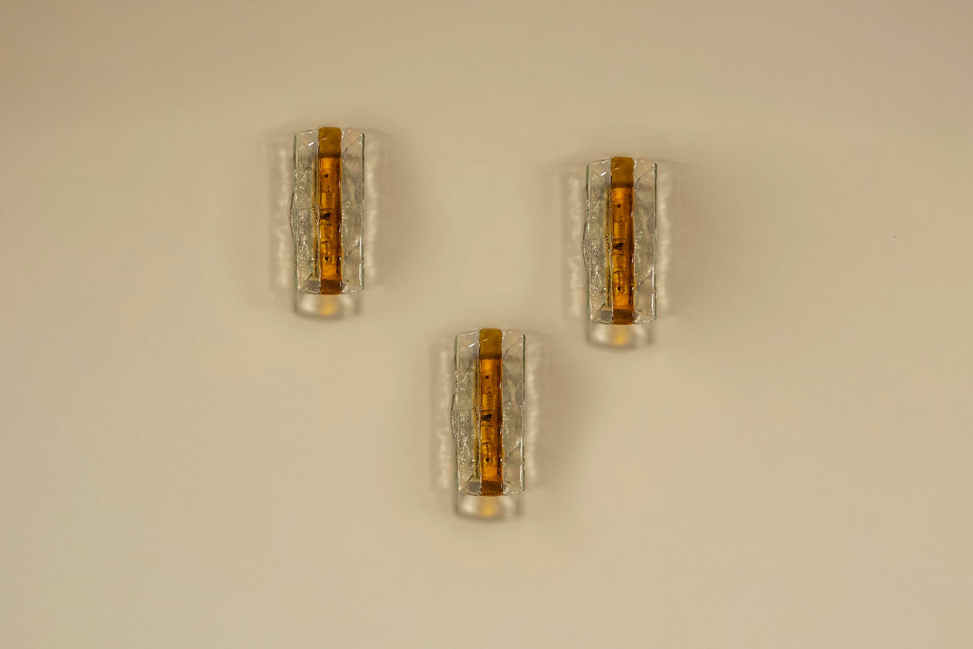 Set_of_3_Amber-colored_Carlo_Nason_Wall_Lamps_for_Mazzega,_Italy_1970s
