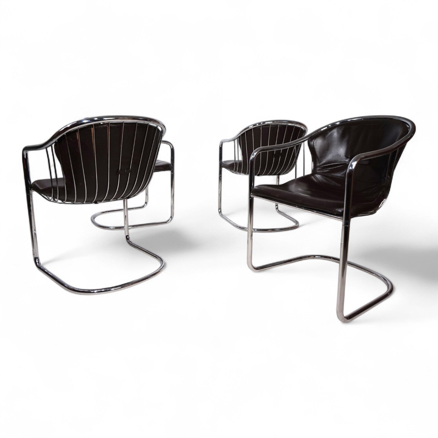 Set_of_4_chrome_dining_chairs_by_Gastone_Rinaldi_for_Thema_from_1970