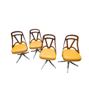 Set_of_4_Grafton_Atomic_Swivel_Chairs_in_Amber_Lucite_and_Mustard_Leather