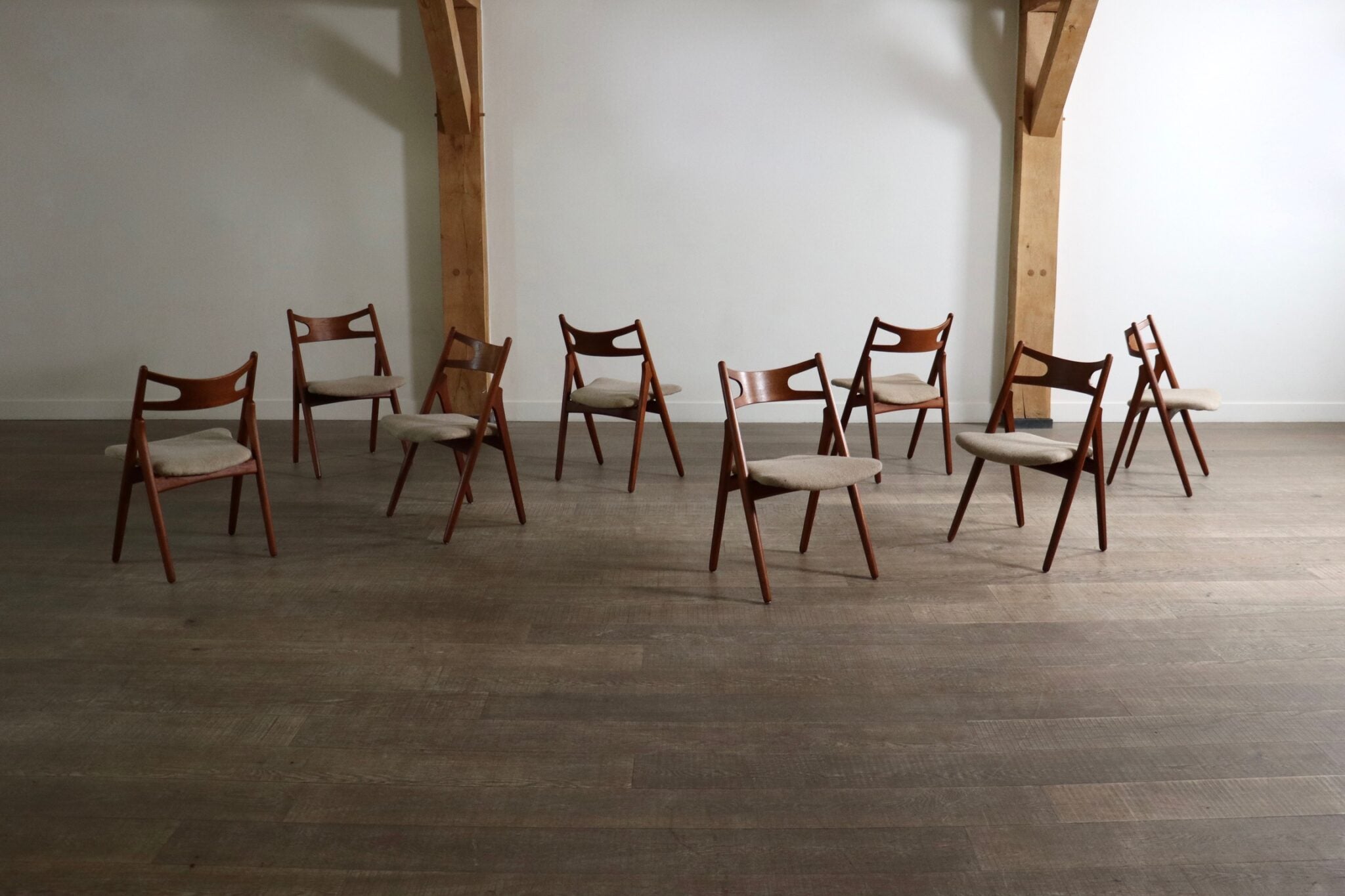 Set_of_8_Hans_Wegner_CH29_Sawbuck_Dining_Chairs_for_Carl_Hansen_&_Son,_1952,_Denmark