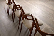Set_of_8_Hans_Wegner_CH29_Sawbuck_Dining_Chairs_for_Carl_Hansen_&_Son,_1952,_Denmark