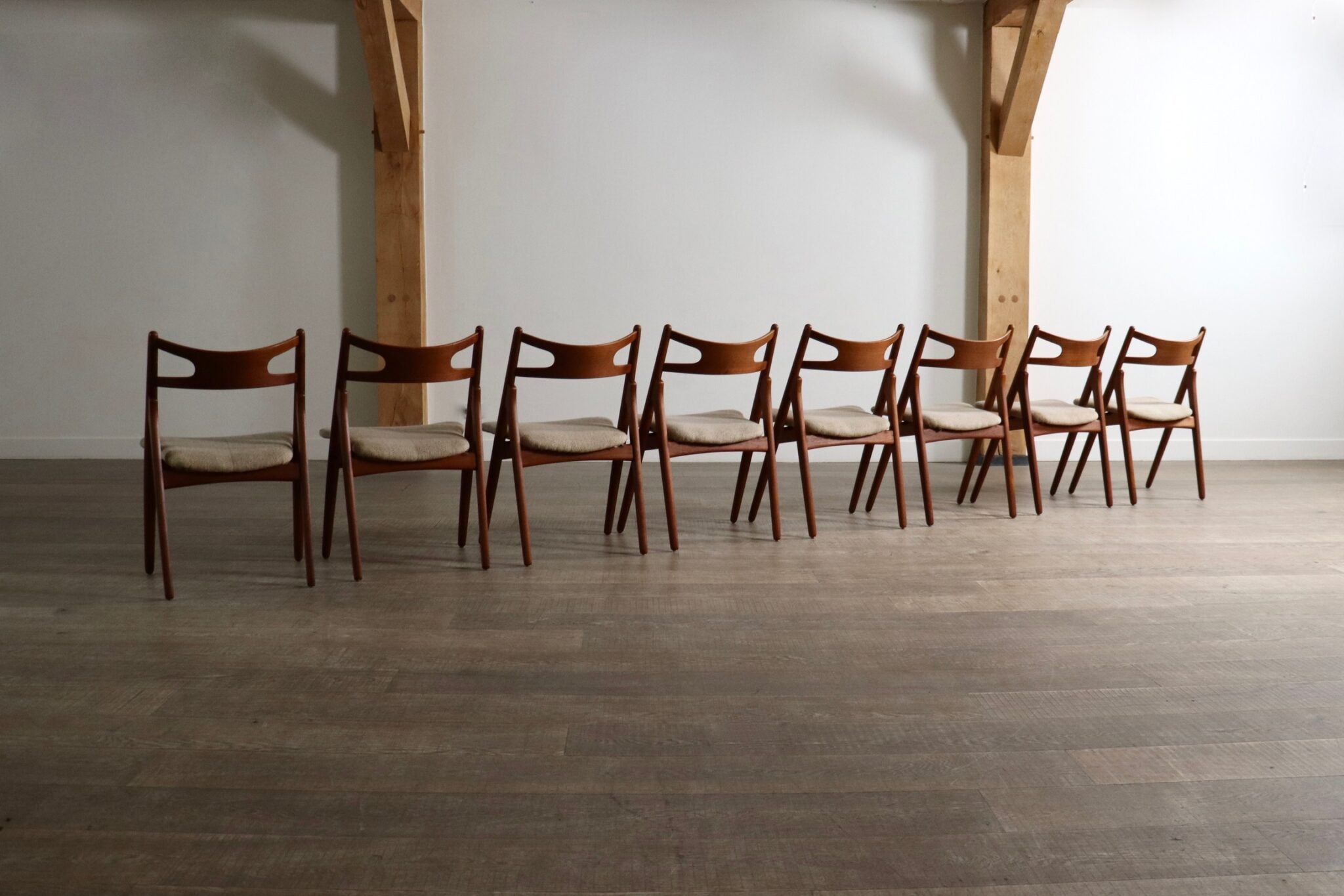 Set_of_8_Hans_Wegner_CH29_Sawbuck_Dining_Chairs_for_Carl_Hansen_&_Son,_1952,_Denmark