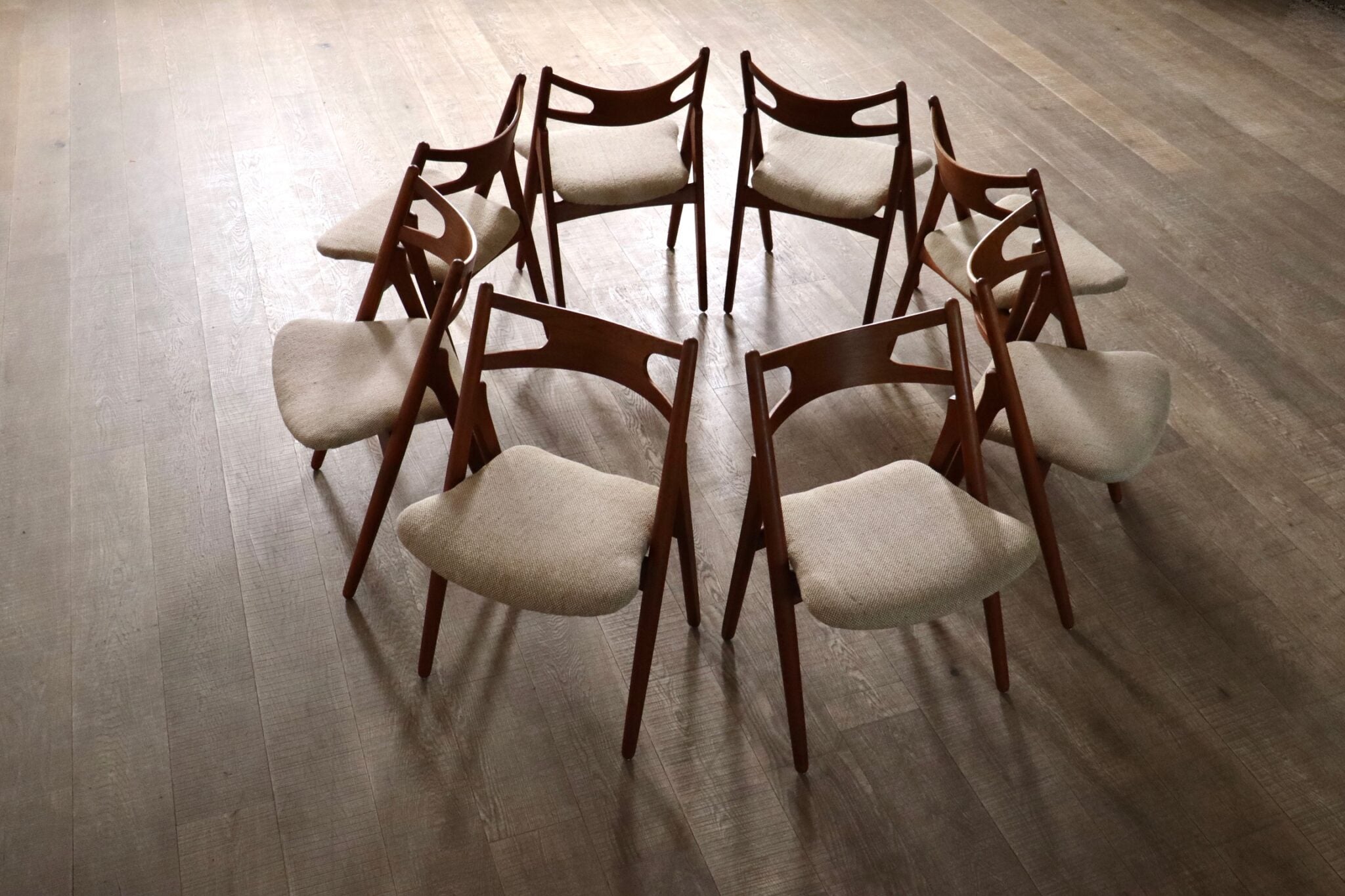 Set_of_8_Hans_Wegner_CH29_Sawbuck_Dining_Chairs_for_Carl_Hansen_&_Son,_1952,_Denmark