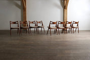 Set_of_8_Hans_Wegner_CH29_Sawbuck_Dining_Chairs_for_Carl_Hansen_&_Son,_1952,_Denmark