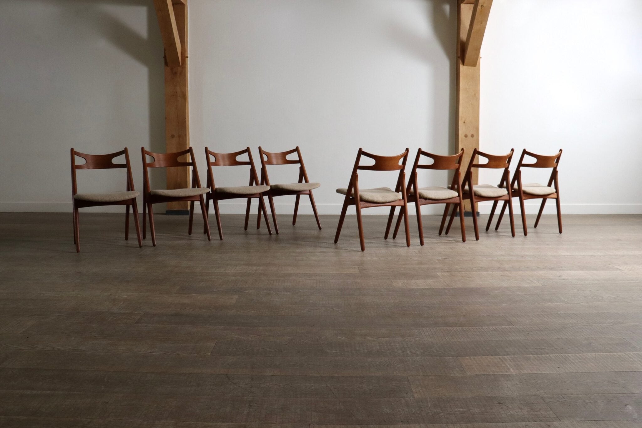 Set_of_8_Hans_Wegner_CH29_Sawbuck_Dining_Chairs_for_Carl_Hansen_&_Son,_1952,_Denmark