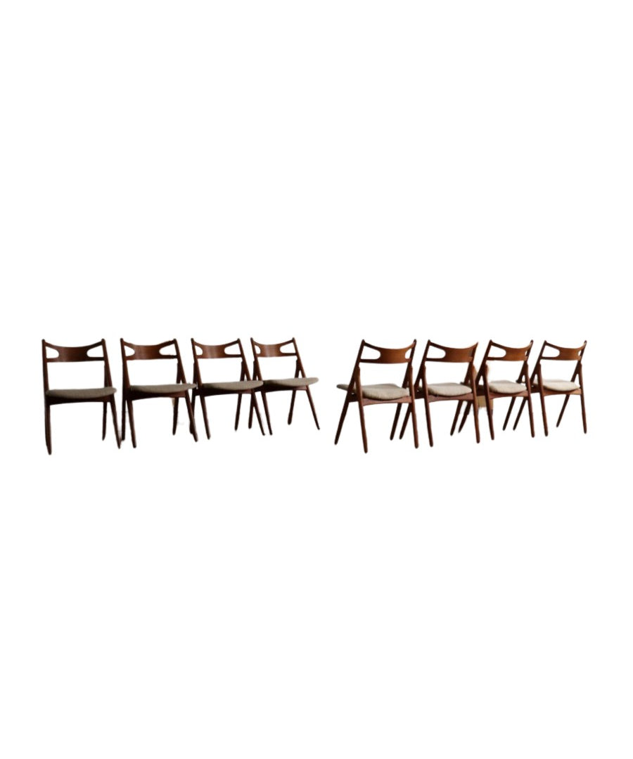 Set_of_8_Hans_Wegner_CH29_Sawbuck_Dining_Chairs_for_Carl_Hansen_&_Son,_1952,_Denmark