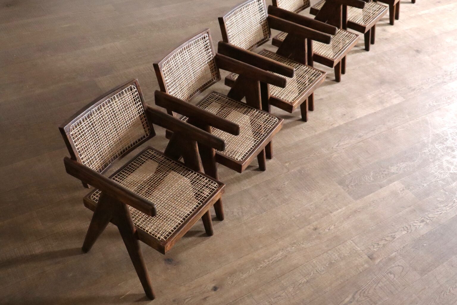 Set_of_8_Pierre_Jeanneret_Office_Cane_Chairs_in_Teak,_Chandigarh,_India,_1950s