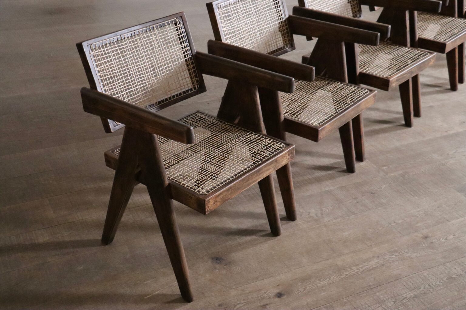 Set_of_8_Pierre_Jeanneret_Office_Cane_Chairs_in_Teak,_Chandigarh,_India,_1950s