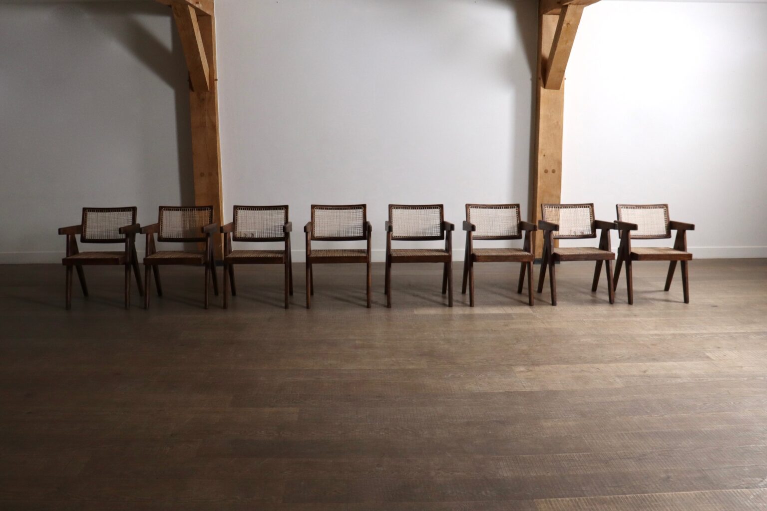 Set_of_8_Pierre_Jeanneret_Office_Cane_Chairs_in_Teak,_Chandigarh,_India,_1950s