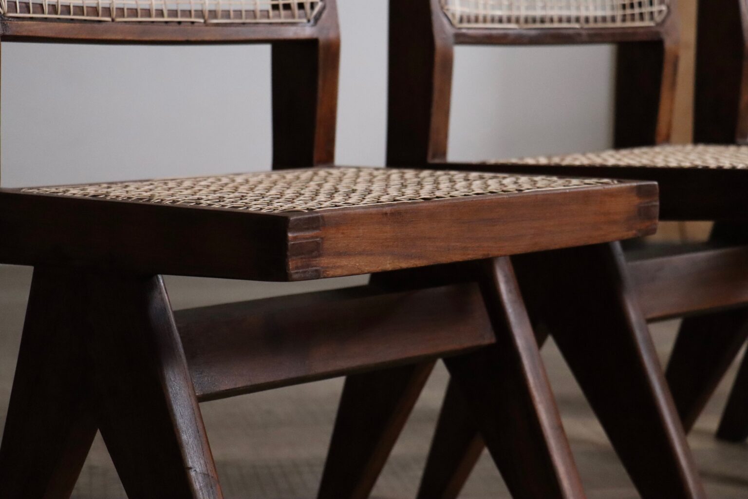 Set_of_8_Pierre_Jeanneret_PJ-SI-25-A_Student_Chairs_in_Teak_and_Cane,_Chandigarh,_1958–59