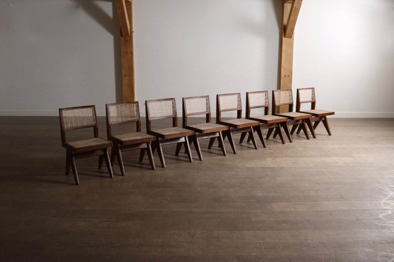 Set_of_8_Pierre_Jeanneret_PJ-SI-25-A_Student_Chairs_in_Teak_and_Cane,_Chandigarh,_1958–59