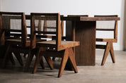 Set_of_8_Pierre_Jeanneret_PJ-SI-25-A_Student_Chairs_in_Teak_and_Cane,_Chandigarh,_1958–59