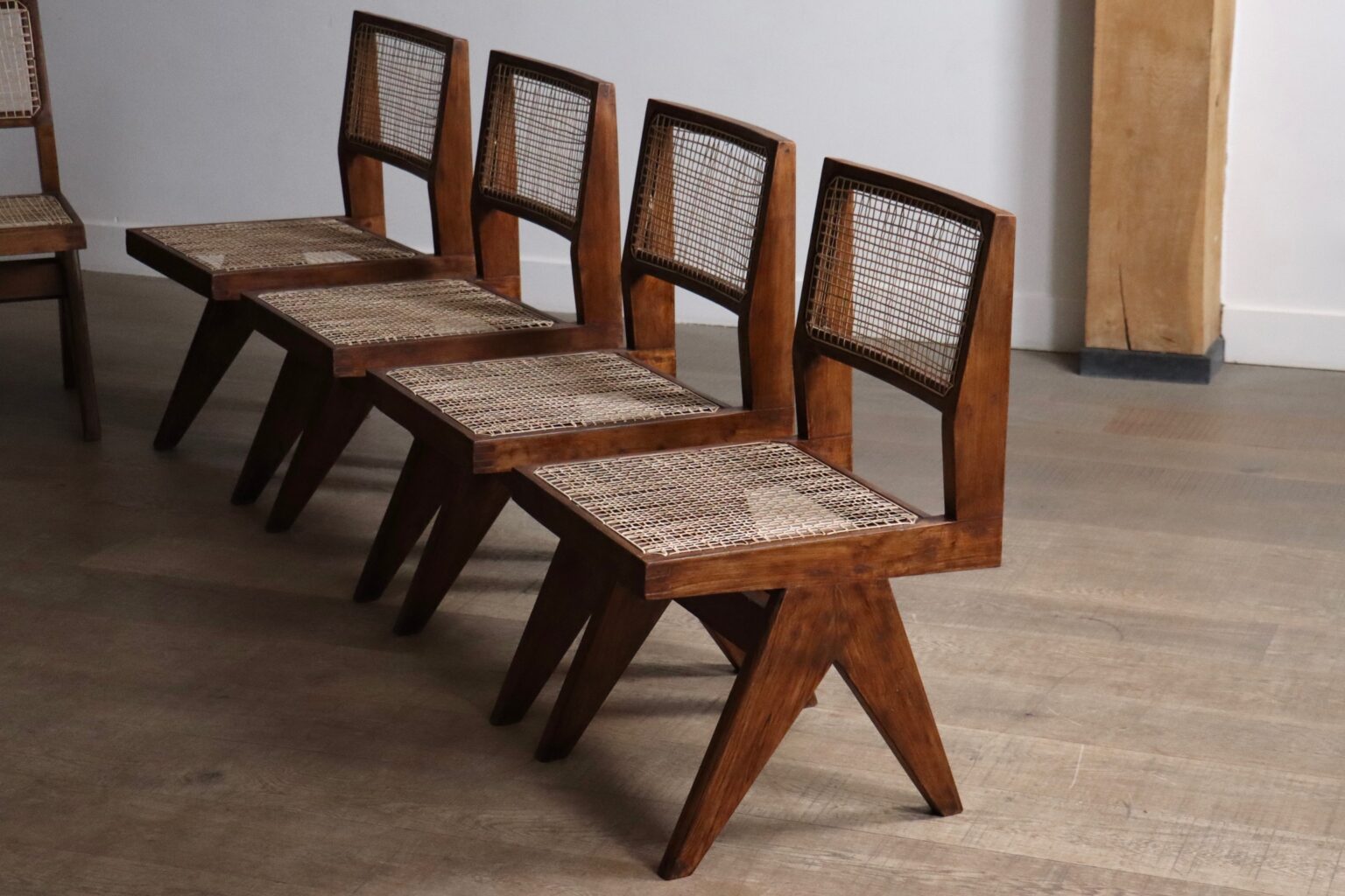 Set_of_8_Pierre_Jeanneret_PJ-SI-25-A_Student_Chairs_in_Teak_and_Cane,_Chandigarh,_1958–59