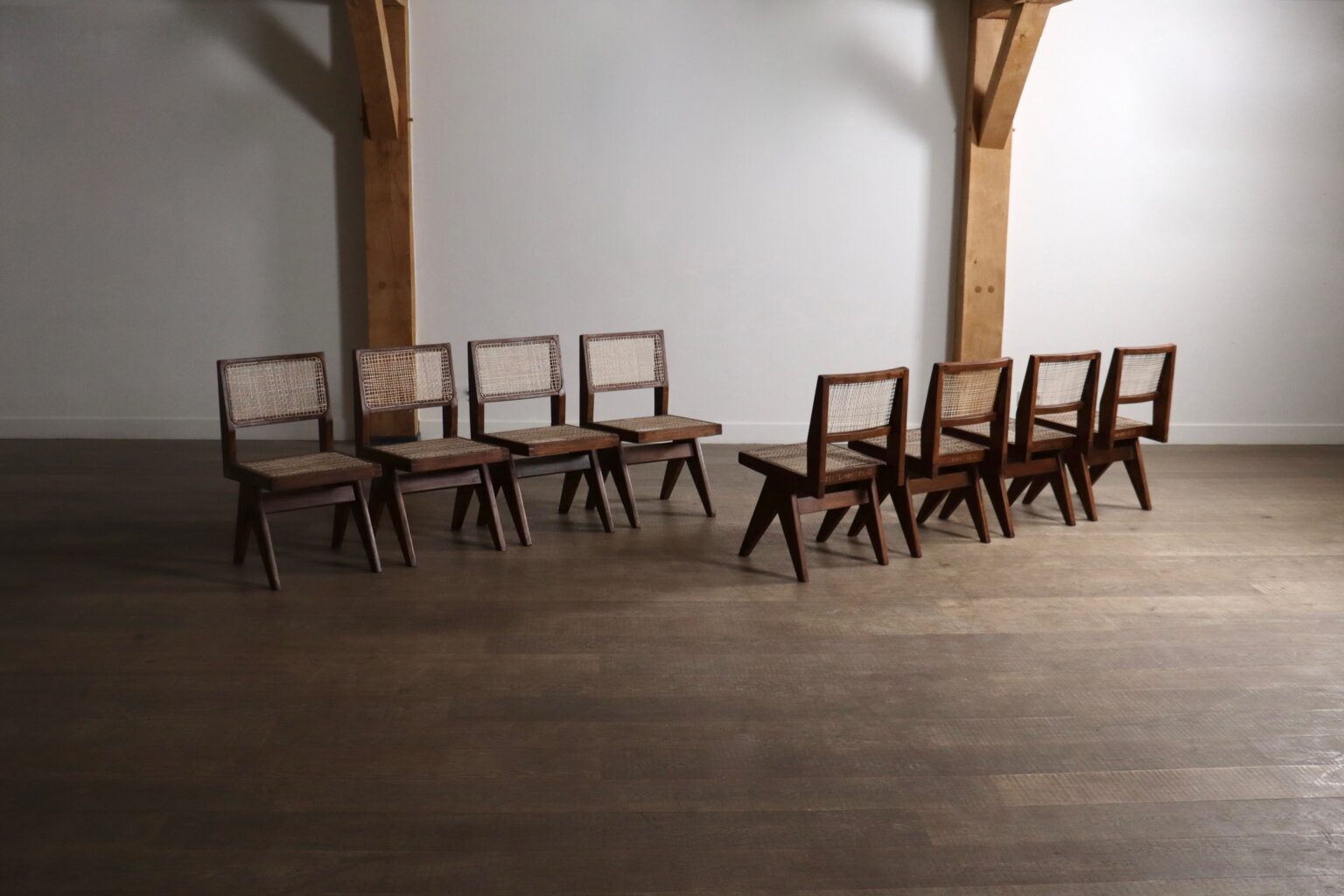 Set_of_8_Pierre_Jeanneret_PJ-SI-25-A_Student_Chairs_in_Teak_and_Cane,_Chandigarh,_1958–59