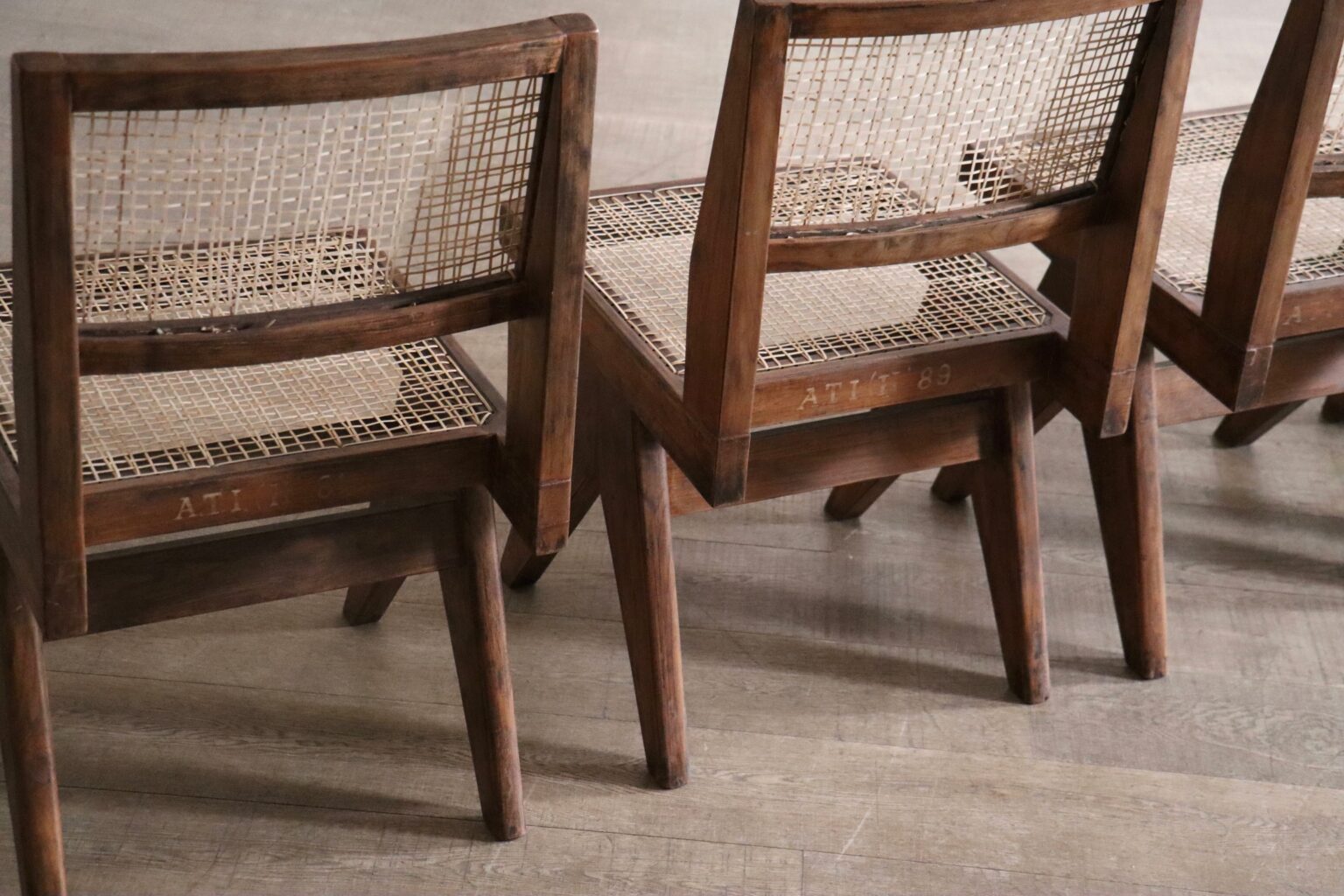 Set_of_8_Pierre_Jeanneret_PJ-SI-25-A_Student_Chairs_in_Teak_and_Cane,_Chandigarh,_1958–59