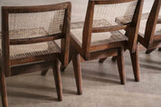 Set_of_8_Pierre_Jeanneret_PJ-SI-25-A_Student_Chairs_in_Teak_and_Cane,_Chandigarh,_1958–59