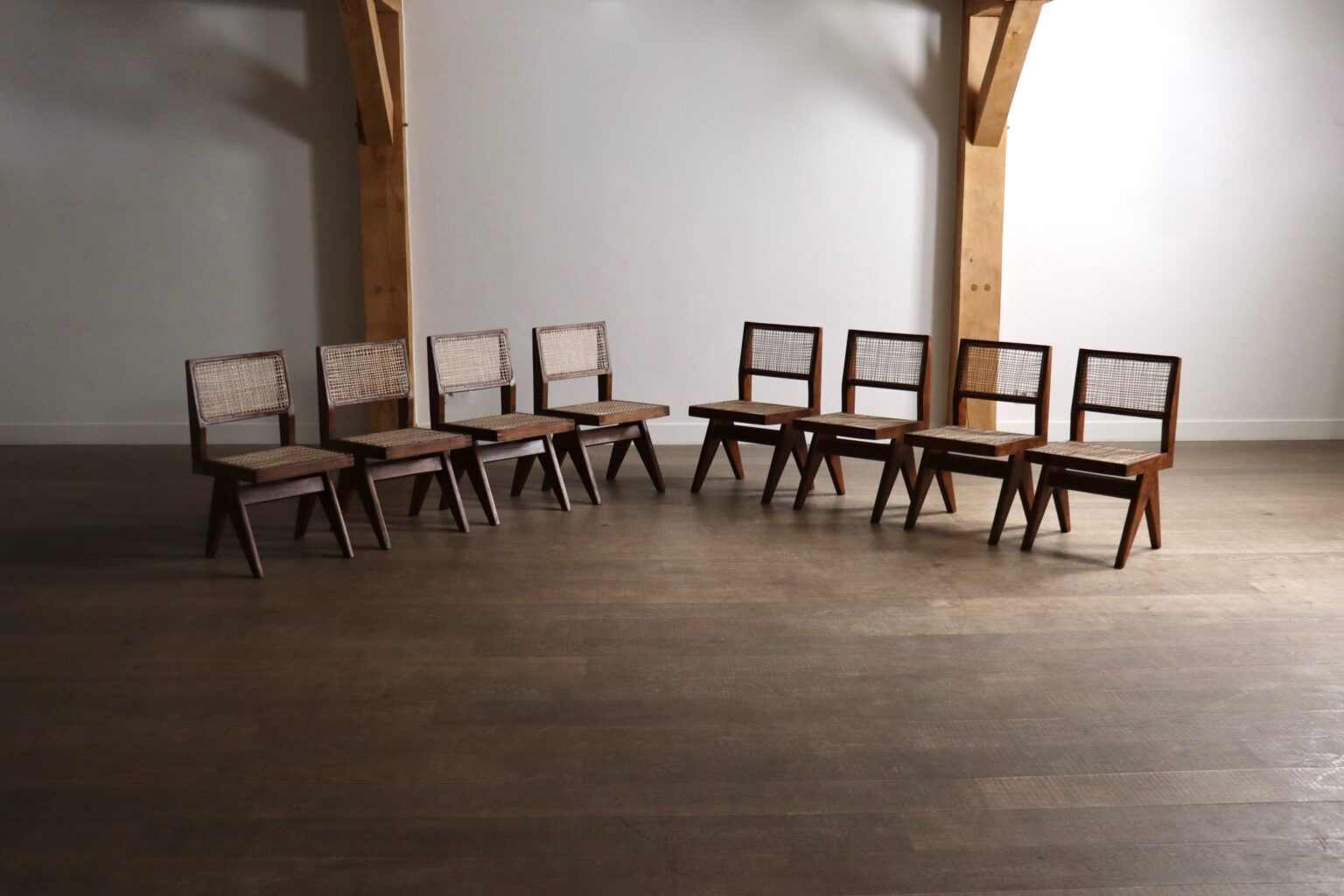 Set_of_8_Pierre_Jeanneret_PJ-SI-25-A_Student_Chairs_in_Teak_and_Cane,_Chandigarh,_1958–59