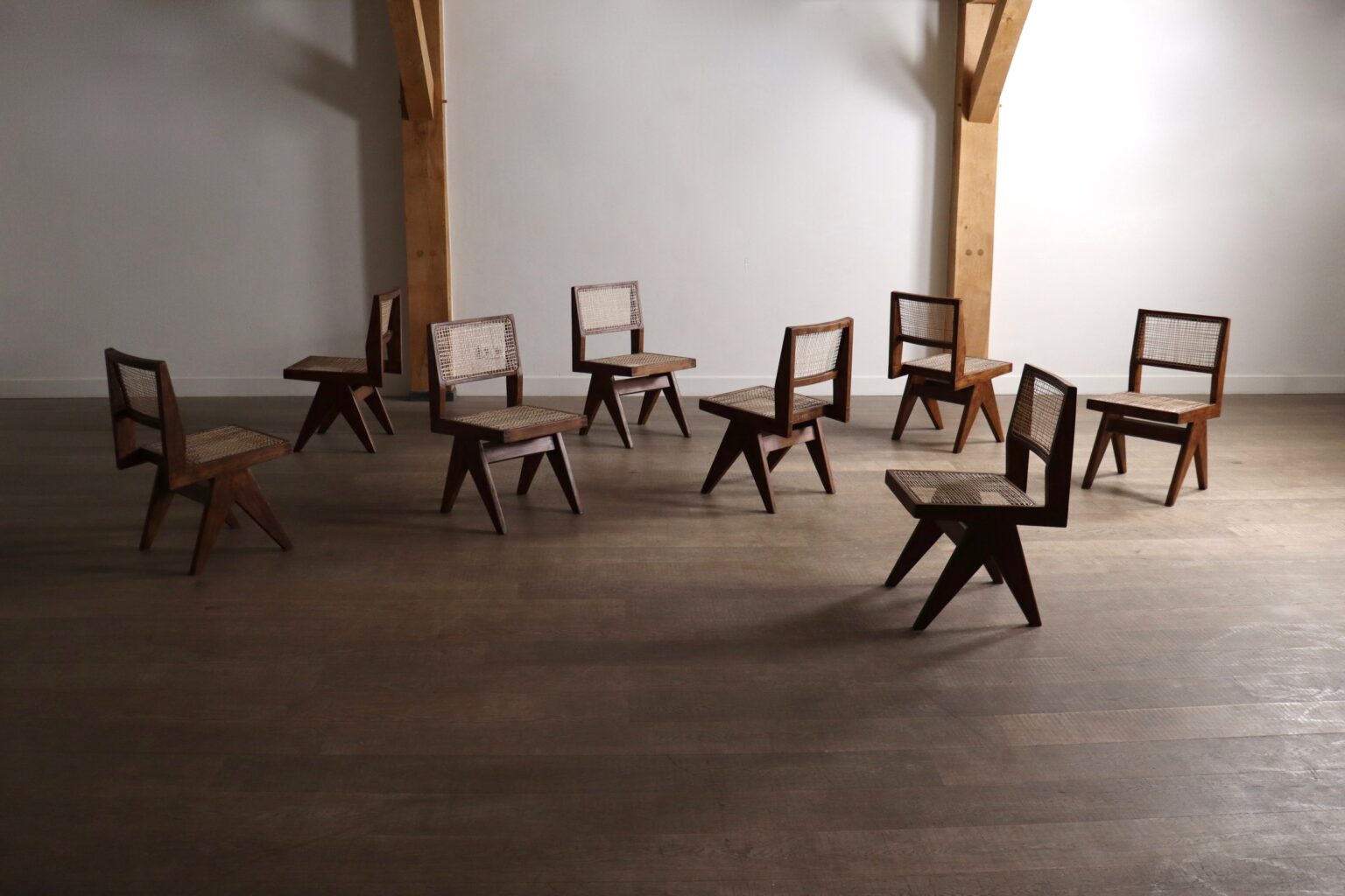 Set_of_8_Pierre_Jeanneret_PJ-SI-25-A_Student_Chairs_in_Teak_and_Cane,_Chandigarh,_1958–59