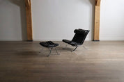 Set_of_Ari_Lounge_Chair_with_Ottoman_by_Arne_Norell_for_Norell_Möbel_AB,_Black_Leather_and_Chrome,_Sweden,_1966
