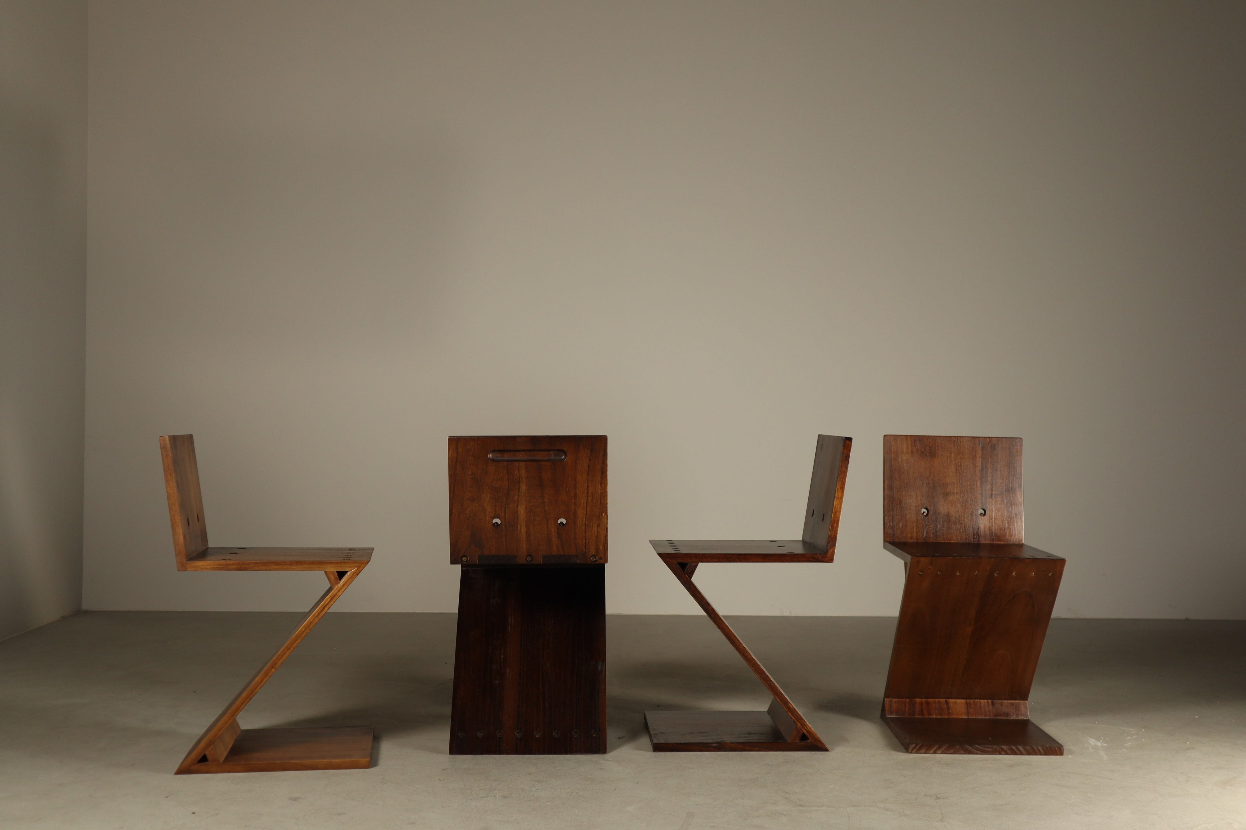 Set_of_4_Handcrafted_Zig-Zag_Chairs_After_Gerrit_Rietveld_in_Dark-Stained_Solid_Wood