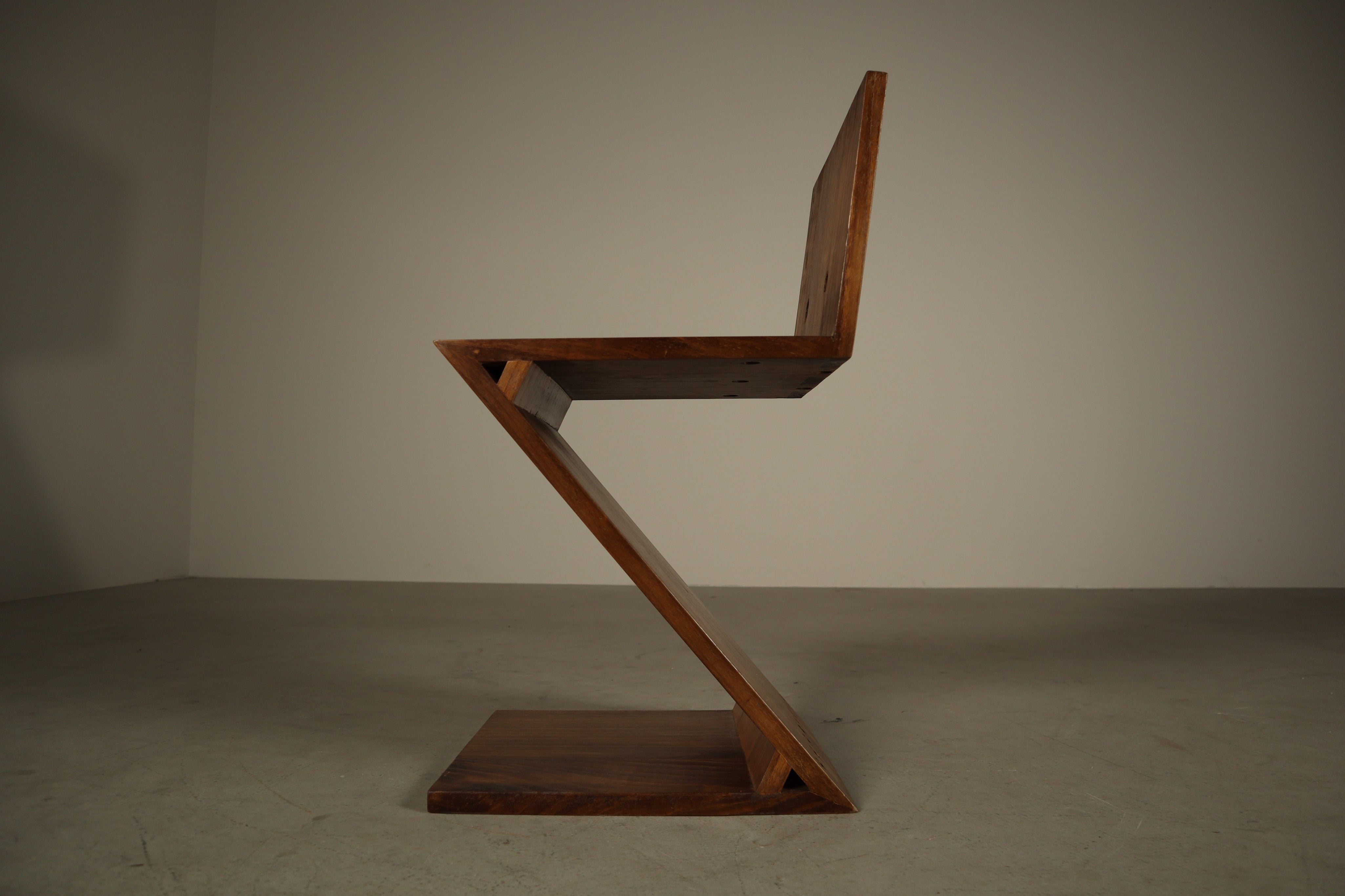 Set_of_4_Handcrafted_Zig-Zag_Chairs_After_Gerrit_Rietveld_in_Dark-Stained_Solid_Wood