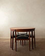 Set_of_Hans_Olsen_Roundette_Extendable_Teak_Dining_for_Frem_Røjle,_Denmark,_1950s