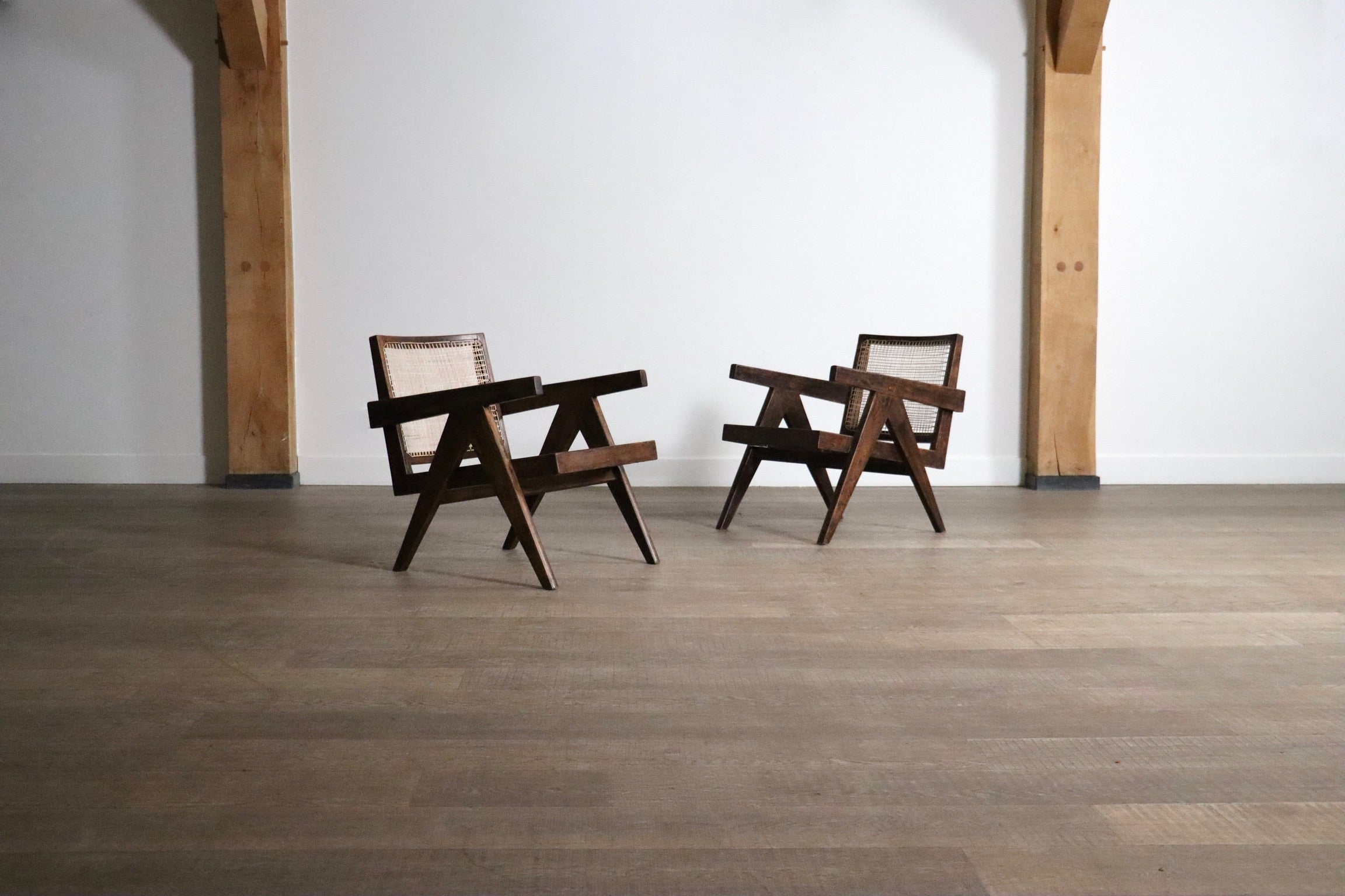 Set_of_2_Pierre_Jeanneret_armchairs_PJ-SI-29-A_in_teak_and_Cane,_1950s