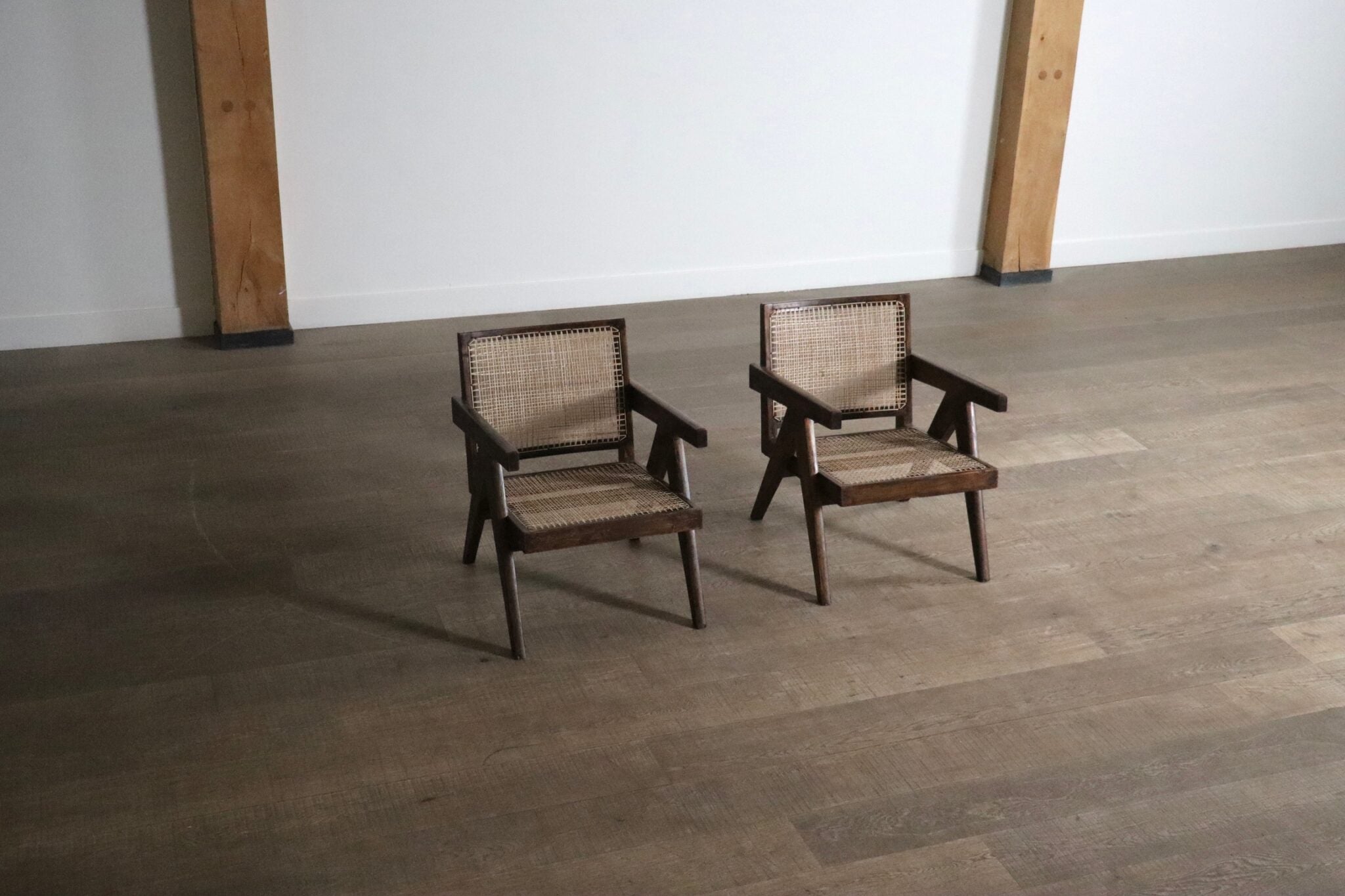 Set_of_2_Pierre_Jeanneret_armchairs_PJ-SI-29-A_in_teak_and_Cane,_1950s