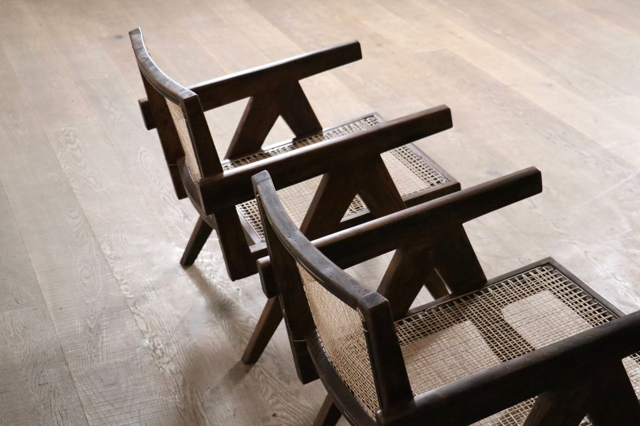 Set_of_2_Pierre_Jeanneret_armchairs_PJ-SI-29-A_in_teak_and_Cane,_1950s
