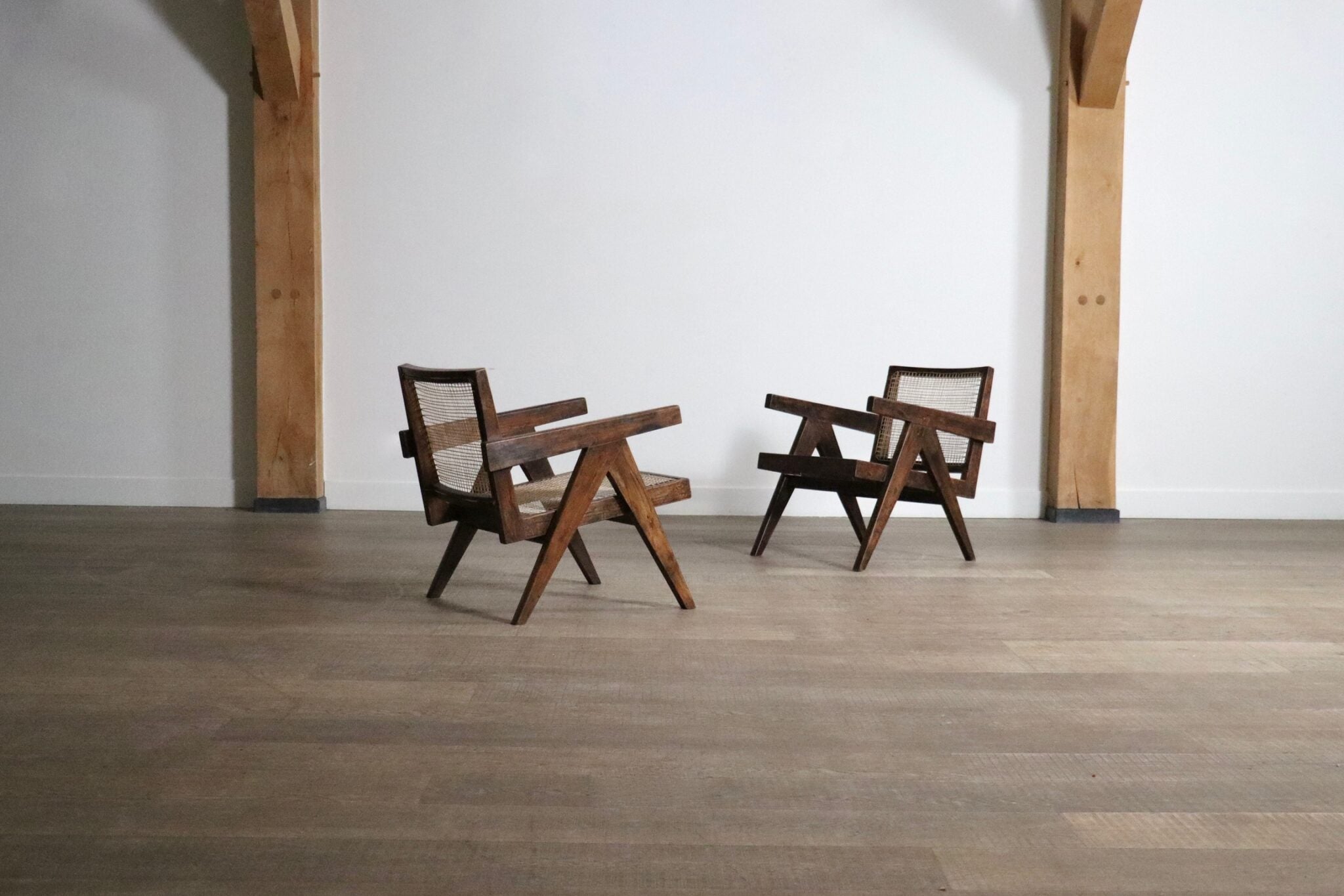 Set_of_2_Pierre_Jeanneret_armchairs_PJ-SI-29-A_in_teak_and_Cane,_1950s