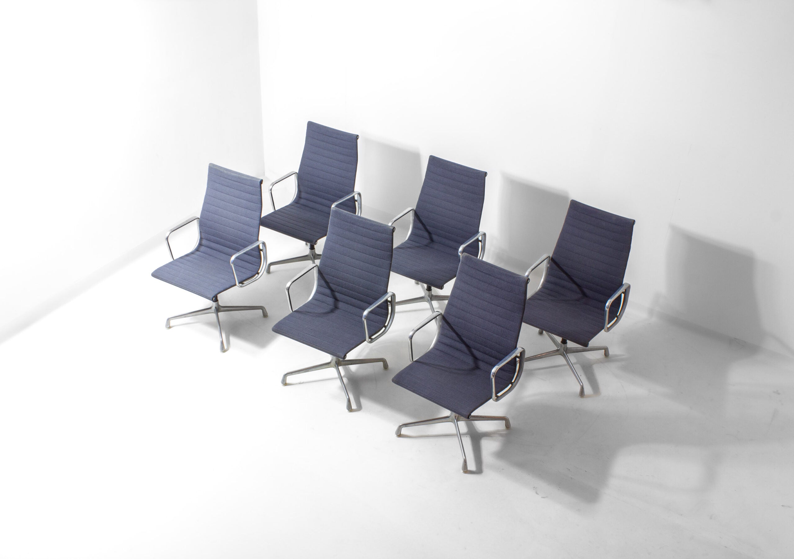 Set_of_6_Eames_EA109_Aluminum_Group_Chairs_for_Herman_Miller,_1980s