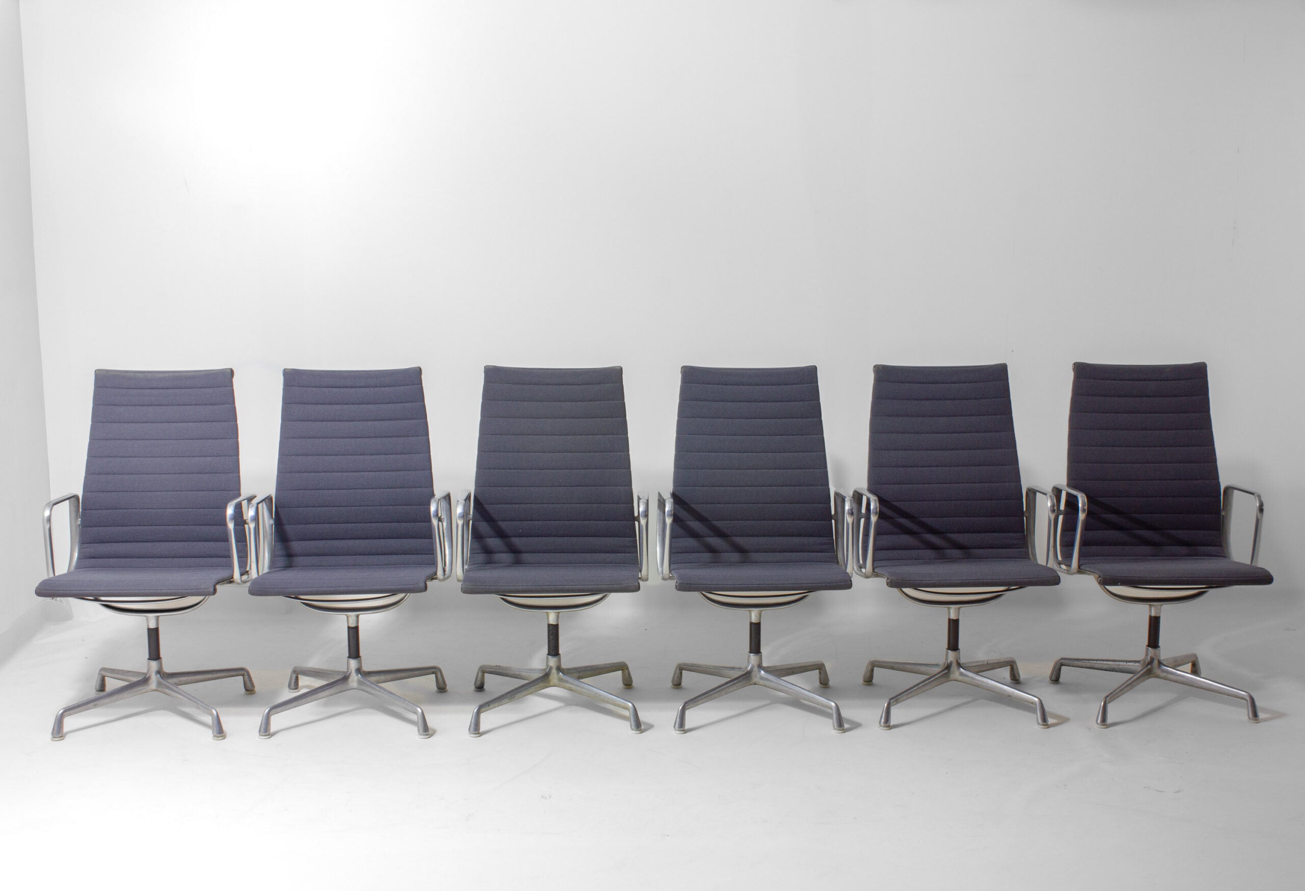 Set_of_6_Eames_EA109_Aluminum_Group_Chairs_for_Herman_Miller,_1980s