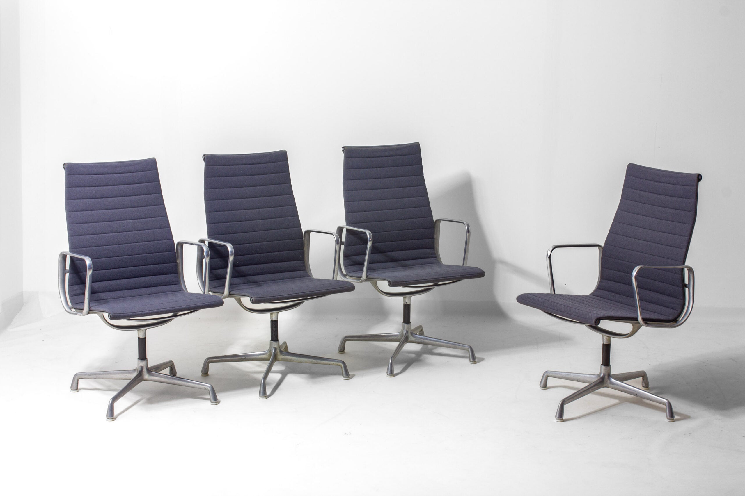 Set_of_6_Eames_EA109_Aluminum_Group_Chairs_for_Herman_Miller,_1980s