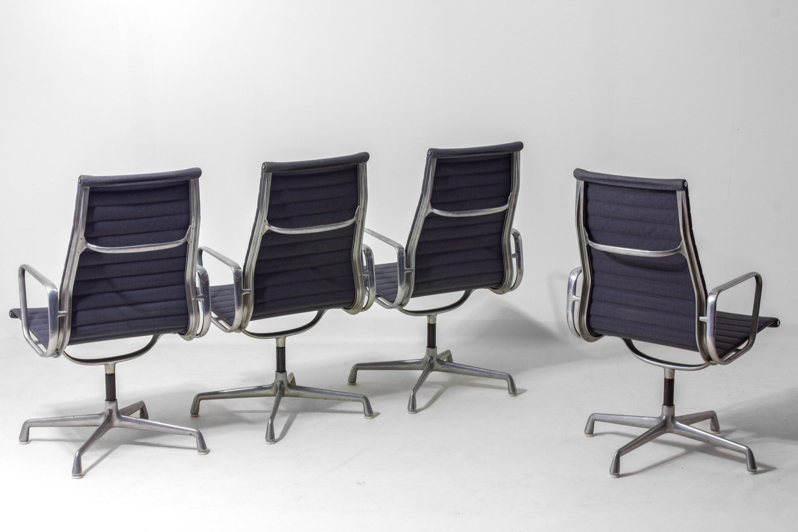 Set_of_6_Eames_EA109_Aluminum_Group_Chairs_for_Herman_Miller,_1980s