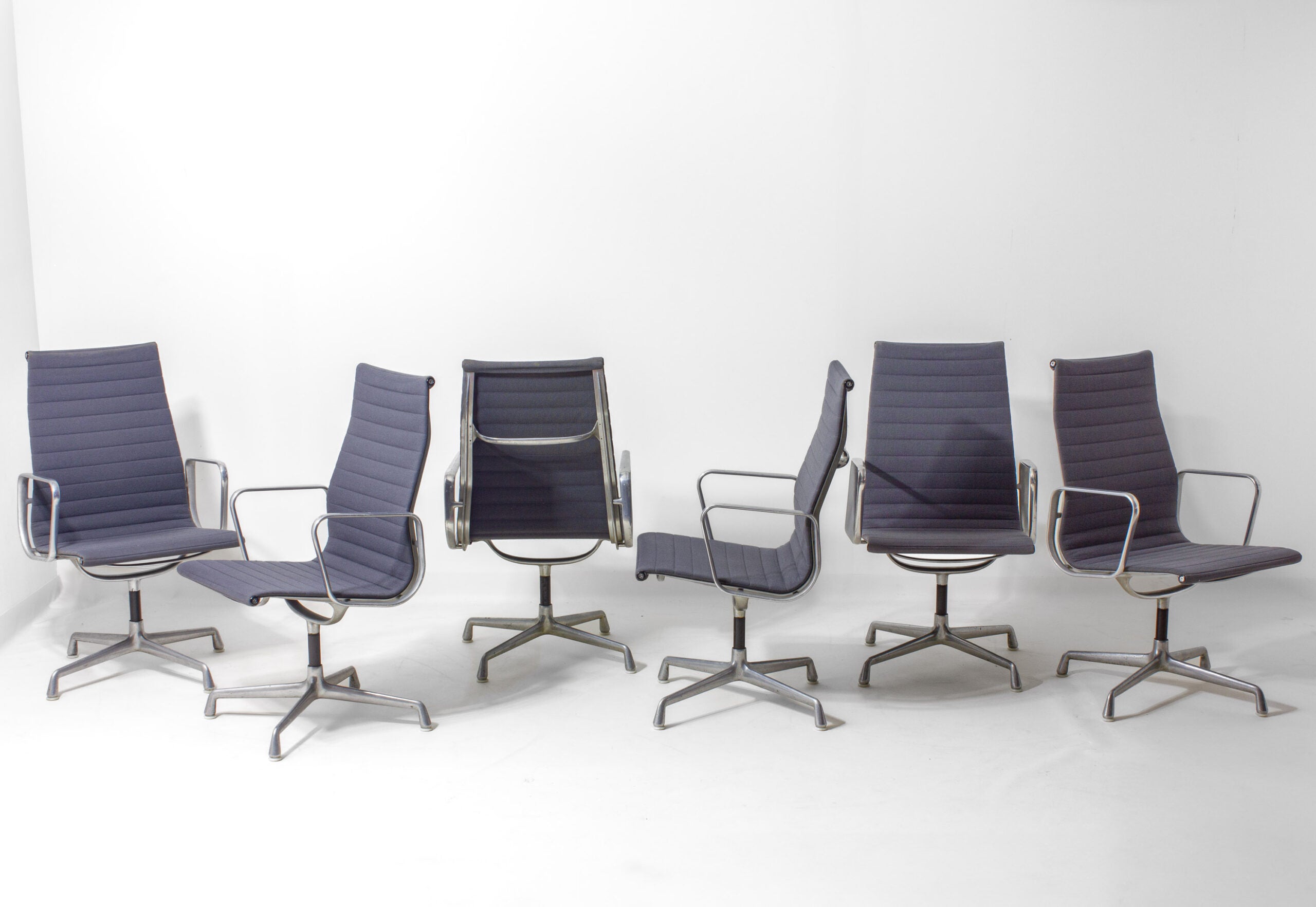 Set_of_6_Eames_EA109_Aluminum_Group_Chairs_for_Herman_Miller,_1980s