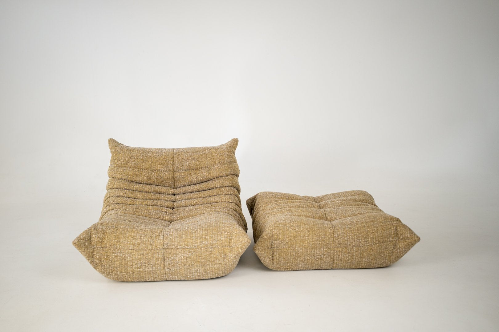 Set_of_Togo_Lounge_Chair_and_Pouf_by_Michel_Ducaroy_for_Ligne_Roset,_Caramel_Loop_Fabric,_France,_1975
