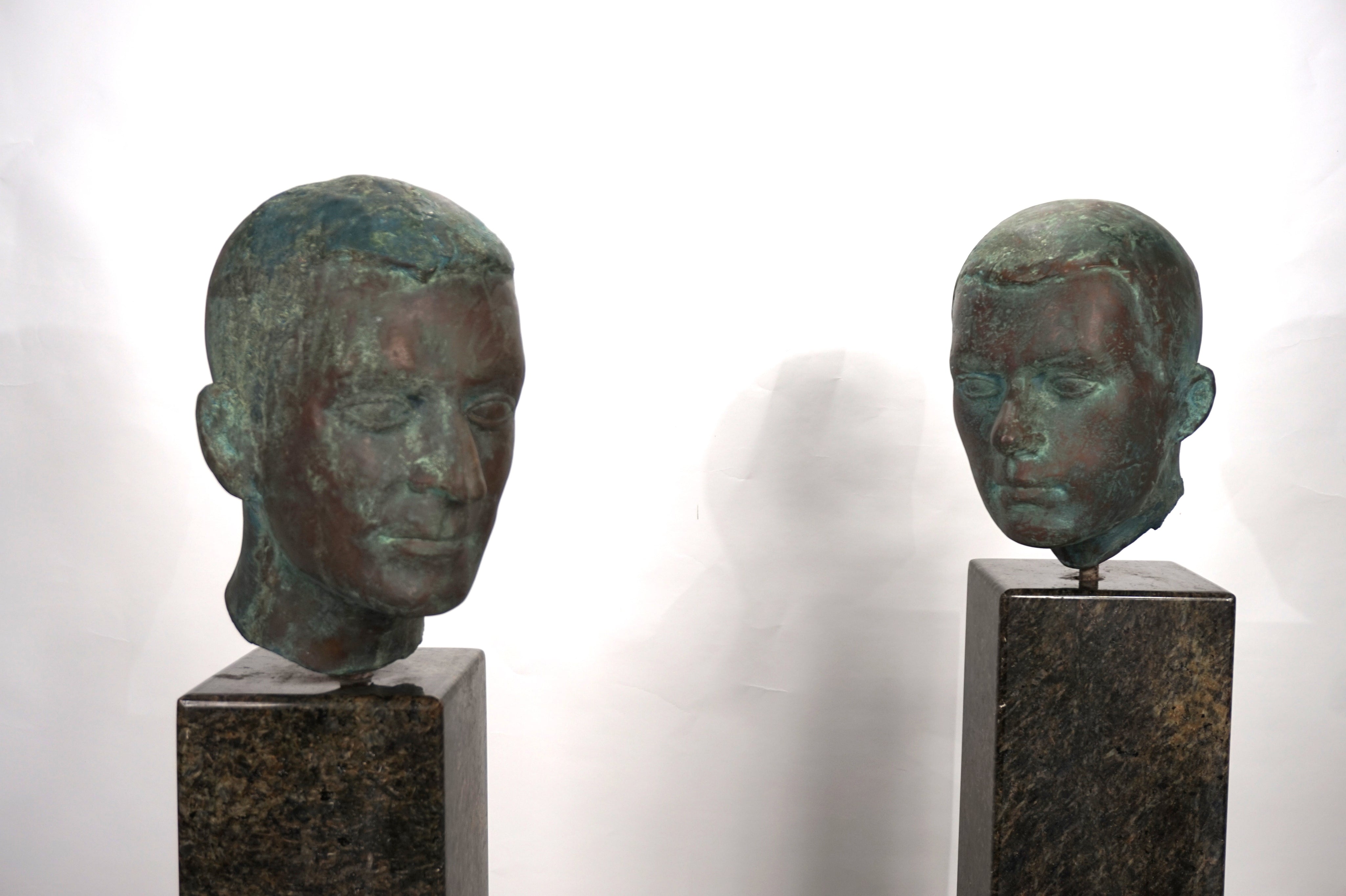 Set_of_2_Life-Size_Bronze_Male_Heads_on_Granite_Steles,_German_Bauhaus_Period,_circa_1920s
