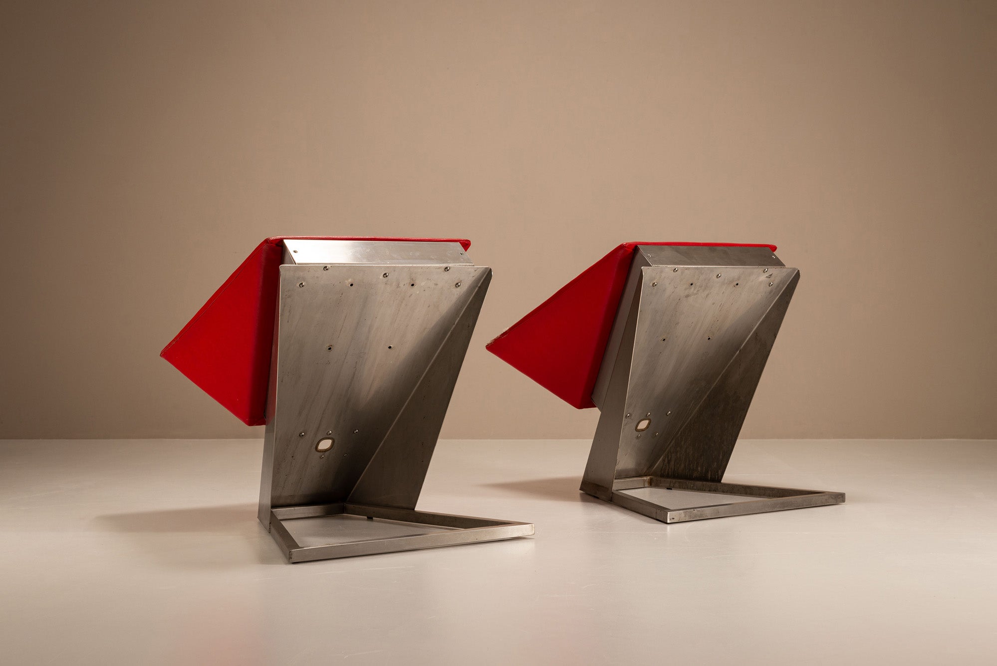 Set_of_2_Sculptural_Lounge_Chairs,_Metal_And_Red_Leather,_1960s,_Italy