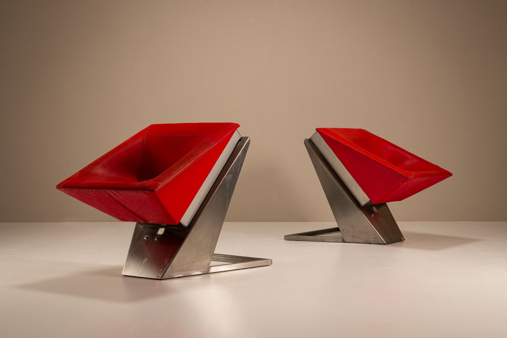 Set_of_2_Sculptural_Lounge_Chairs,_Metal_And_Red_Leather,_1960s,_Italy
